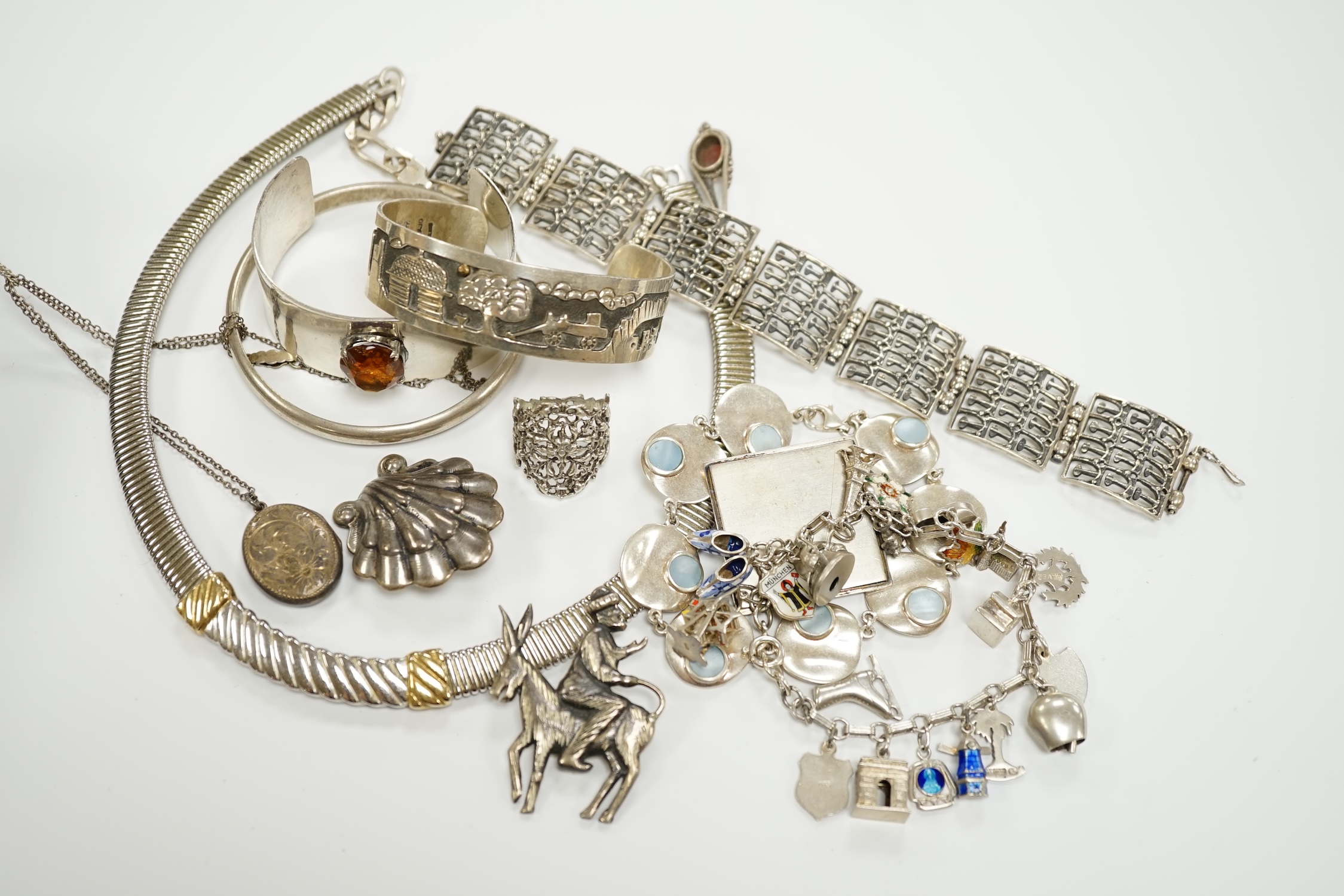 A quantity of assorted silver, white metal and sterling jewellery including brooches, cuff bracelets, charm bracelets, rings etc, gross weight 18.5oz.